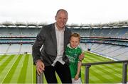 30 May 2015; Derry great Anthony Tohill with Dáithi Mohan, aged 7, from Donagh, Fermanagh, at today’s Bord Gáis Energy Legends Tour at Croke Park where he relived some of most memorable moments from his playing and managerial career. All Bord Gáis Energy Legends Tours include a trip to the GAA Museum, which is home to many exclusive exhibits, including the official GAA Hall of Fame. For booking and ticket information about the GAA legends for this summer’s tours visit www.crokepark.ie/gaa-museum. Croke Park, Dublin. Picture credit: Piaras Ó Mídheach / SPORTSFILE
