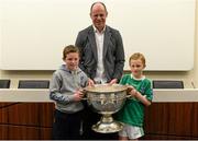 30 May 2015; Derry great Anthony Tohill with Riain O'Kane, left, aged 9, from Swatragh, Derry, and Dáithi Mohan, aged 7, from Donagh, Fermanagh, at today’s Bord Gáis Energy Legends Tour at Croke Park where he relived some of most memorable moments from his playing and managerial career. All Bord Gáis Energy Legends Tours include a trip to the GAA Museum, which is home to many exclusive exhibits, including the official GAA Hall of Fame. For booking and ticket information about the GAA legends for this summer’s tours visit www.crokepark.ie/gaa-museum. Croke Park, Dublin. Picture credit: Piaras Ó Mídheach / SPORTSFILE