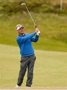 30 May 2015; Soren Kjeldsen, Denmark, watches his second shot the 18th green. Dubai Duty Free Irish Open Golf Championship 2015, Day 3. Royal County Down Golf Club, Co. Down. Picture credit: Brendan Moran / SPORTSFILE