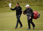 30 May 2015; Padraig Harrington, Ireland, and his caddie Ronan Flood, as he approaches the 18th green. Dubai Duty Free Irish Open Golf Championship 2015, Day 3. Royal County Down Golf Club, Co. Down. Picture credit: Oliver McVeigh / SPORTSFILE