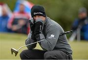 30 May 2015; Richie Ramsay, Scotland, keeping warm on the 9th Green. Dubai Duty Free Irish Open Golf Championship 2015, Day 3. Royal County Down Golf Club, Co. Down. Picture credit: Oliver McVeigh / SPORTSFILE