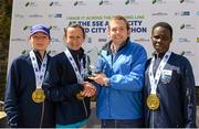 31 May 2015; Pictured, from left, are Collette McCourt, Newry, Co. Down, 3rd place, Pauline Curley, Tullamore, Co. Offaly, winner, Peter Cunningham, SSE Airtricity, and Selina Kengogo, Kenya, runner up, after the SSE Airtricity Derry Marathon. Guildhall Square, Derry. Picture credit: Oliver McVeigh / SPORTSFILE