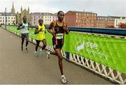 31 May 2015; Gideon Kipsang, right, Peter Somba, middle, and Freddy Sittuk, left, all from Kenya, lead the race across the Craigavon bridge in the SSE Airtricity Derry Marathon. Guildhall Square, Derry. Picture credit: Oliver McVeigh / SPORTSFILE