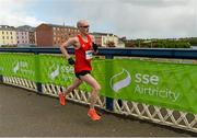 31 May 2015; Greg Roberts, from Derry, who finished in third place, crossing the Craigavon bridge in the SSE Airtricity Derry Marathon. Guildhall Square, Derry. Picture credit: Oliver McVeigh / SPORTSFILE