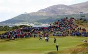 31 May 2015; The crowd at the back of the 5th green watch Padraig Harrington, Ireland, and Matt Ford, England, putt out. Dubai Duty Free Irish Open Golf Championship 2015, Final Day. Royal County Down Golf Club, Co. Down. Picture credit: John Dickson / SPORTSFILE