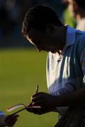 12 July 2008; Limerick goalkeeper Brian Murray, wearing an Offaly jersey, signs an autograph book after the game. GAA Hurling All-Ireland Senior Championship Qualifier, Round 3, Limerick v Offaly, Gaelic Grounds, Limerick. Picture credit: Ray McManus / SPORTSFILE