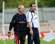 19 July 2008; Derry manager Paddy Crozier, left, enjoys a light hearted moment with Monaghan manager Seamus McEnaney during the game. GAA Football All-Ireland Senior Championship Qualifier - Round 1, Monaghan v Derry. Clones, Co. Monaghan. Picture credit: Oliver McVeigh / SPORTSFILE