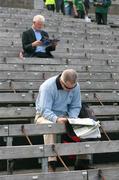 20 July 2008; Two fans read the match programme before the game. GAA Football Ulster Senior Championship Final, Armagh v Fermanagh, St Tighearnach's Park, Clones, Co. Monaghan. Picture credit: Oliver McVeigh / SPORTSFILE