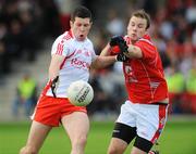 19 July 2008; Sean Cavanagh, Tyrone, in action against Mick Fanning, Louth. GAA Football All-Ireland Senior Campionship Qualifier - Round 1, Louth v Tyrone, Drogheda, Co. Louth. Picture credit: Brian Lawless / SPORTSFILE