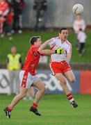 19 July 2008; Michael McGee, Tyrone, in action against John Neary, Louth. GAA Football All-Ireland Senior Campionship Qualifier - Round 1, Louth v Tyrone, Drogheda, Co. Louth. Picture credit: Brian Lawless / SPORTSFILE