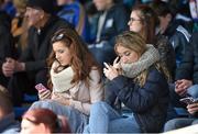 31 May 2015; Two supporters use their mobile phones during the game. Munster GAA Football Senior Championship, Quarter-Final, Waterford v Tipperary. Semple Stadium, Thurles, Co. Tipperary. Picture credit: Diarmuid Greene / SPORTSFILE