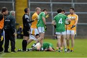 31 May 2015; Ciaran O'Flaherty, Fermanagh, lying on the ground after a first half incident which resulted in Sean McVeigh, Antrim, being sent off by referee Maurice Deegan as Fermanagh manager Peter McGrath, extreme left, looks on. GAA Football Senior Championship, Quarter-Final, Fermanagh v Antrim, Brewster Park, Enniskillen, Co. Fermanagh. Picture credit: Oliver McVeigh / SPORTSFILE