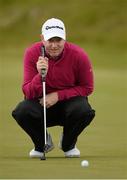 30 May 2015; Richard McEvoy, England, lines up a putt on the 1st green. Dubai Duty Free Irish Open Golf Championship 2015, Day 3. Royal County Down Golf Club, Co. Down. Picture credit: Brendan Moran / SPORTSFILE