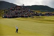 29 May 2015; Rory McIlroy, Northern Ireland, watches his second shot on the 2nd fairway in front of a large gallery. Dubai Duty Free Irish Open Golf Championship 2015, Day 2. Royal County Down Golf Club, Co. Down. Picture credit: Brendan Moran / SPORTSFILE