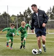 2 June 2015; Republic of Ireland and Everton midfielder Aiden McGeady officially launched the McDonald’s FAI Future Football 2015 programme. McDonald’s FAI Future Football is a programme designed to support grassroots football clubs by enriching the work they do at local level. Over 10,000 boys and girls from 165 football clubs in Ireland will take part this year, generating 70,000 additional hours of activity. This year McDonald’s will shine a special light on the 800 coaches that help run the programme, by rewarding them as a thank you for their tireless work in developing young footballers throughout the country. The partnership, in its third year, adds to McDonald’s global investment in football. Pictured at the launch was Republic of Ireland's Aiden McGeady with Isobel O'Kane, age 7, and Callum Carroll, age 8. Gannon Park, Malahide, Co. Dublin Picture credit: David Maher / SPORTSFILE