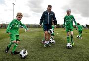 2 June 2015; Republic of Ireland and Everton midfielder Aiden McGeady officially launched the McDonald’s FAI Future Football 2015 programme. McDonald’s FAI Future Football is a programme designed to support grassroots football clubs by enriching the work they do at local level. Over 10,000 boys and girls from 165 football clubs in Ireland will take part this year, generating 70,000 additional hours of activity. This year McDonald’s will shine a special light on the 800 coaches that help run the programme, by rewarding them as a thank you for their tireless work in developing young footballers throughout the country. The partnership, in its third year, adds to McDonald’s global investment in football. Pictured at the launch was Republic of Ireland's Aiden McGeady with Callum Carroll, age 8, and Rachel Fitzmaurice, age 9. Gannon Park, Malahide, Co. Dublin Picture credit: David Maher / SPORTSFILE