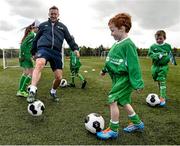 2 June 2015; Republic of Ireland and Everton midfielder Aiden McGeady officially launched the McDonald’s FAI Future Football 2015 programme. McDonald’s FAI Future Football is a programme designed to support grassroots football clubs by enriching the work they do at local level. Over 10,000 boys and girls from 165 football clubs in Ireland will take part this year, generating 70,000 additional hours of activity. This year McDonald’s will shine a special light on the 800 coaches that help run the programme, by rewarding them as a thank you for their tireless work in developing young footballers throughout the country. The partnership, in its third year, adds to McDonald’s global investment in football. Pictured at the launch was Republic of Ireland's Aiden McGeady with  twins Tadhg and Conor Scanlon, age 7. Gannon Park, Malahide, Co. Dublin Picture credit: David Maher / SPORTSFILE
