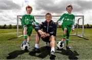 2 June 2015; Republic of Ireland and Everton midfielder Aiden McGeady officially launched the McDonald’s FAI Future Football 2015 programme. McDonald’s FAI Future Football is a programme designed to support grassroots football clubs by enriching the work they do at local level. Over 10,000 boys and girls from 165 football clubs in Ireland will take part this year, generating 70,000 additional hours of activity. This year McDonald’s will shine a special light on the 800 coaches that help run the programme, by rewarding them as a thank you for their tireless work in developing young footballers throughout the country. The partnership, in its third year, adds to McDonald’s global investment in football. Pictured at the launch was Republic of Ireland's Aiden McGeady with twins Tadhg, left, and Conor Scanlon, age 7. Gannon Park, Malahide, Co. Dublin Picture credit: David Maher / SPORTSFILE