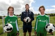 2 June 2015; Republic of Ireland and Everton midfielder Aiden McGeady officially launched the McDonald’s FAI Future Football 2015 programme. McDonald’s FAI Future Football is a programme designed to support grassroots football clubs by enriching the work they do at local level. Over 10,000 boys and girls from 165 football clubs in Ireland will take part this year, generating 70,000 additional hours of activity. This year McDonald’s will shine a special light on the 800 coaches that help run the programme, by rewarding them as a thank you for their tireless work in developing young footballers throughout the country. The partnership, in its third year, adds to McDonald’s global investment in football. Pictured at the launch was Republic of Ireland's Aiden McGeady with  twins  Sarah, left, and Rachel Fitzmaurice, age 9. Gannon Park, Malahide, Co. Dublin Picture credit: David Maher / SPORTSFILE