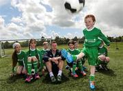 2 June 2015; Republic of Ireland and Everton midfielder Aiden McGeady officially launched the McDonald’s FAI Future Football 2015 programme. McDonald’s FAI Future Football is a programme designed to support grassroots football clubs by enriching the work they do at local level. Over 10,000 boys and girls from 165 football clubs in Ireland will take part this year, generating 70,000 additional hours of activity. This year McDonald’s will shine a special light on the 800 coaches that help run the programme, by rewarding them as a thank you for their tireless work in developing young footballers throughout the country. The partnership, in its third year, adds to McDonald’s global investment in football. Pictured at the launch was Conor Scanlon, age 7, showing off his skills to Republic of Ireland's Aiden McGeady. Gannon Park, Malahide, Co. Dublin Picture credit: David Maher / SPORTSFILE