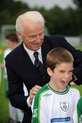 25 July 2008; Republic of Ireland manager Giovanni Trapattoni signs a jersey for eight-year-old Conor Melly, from Castlebar, who was attending the Football Association of Ireland Summer Soccer School. Milebush Park, Castlebar, Co. Mayo. Picture credit: Ray McManus / SPORTSFILE