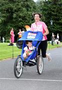 27 July 2008; Edel O'Connell from Infirmary road, Dublin, and her two year old Daughter, Aisling, compete in the 5K Fun Run. Athletics Ireland Family Fun Festival, Farmleigh, Phoenix Park, Dublin. Picture credit: Tomas Greally / SPORTSFILE