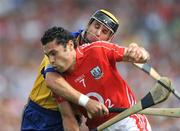 27 July 2008; Cork's Sean Og O hAilpin clears under pressure from Clare's Tony Griffin. GAA Hurling All-Ireland Senior Championship Quarter-Final, Clare v Cork, Semple Stadium, Thurles, Co. Tipperary. Picture credit: Ray McManus / SPORTSFILE