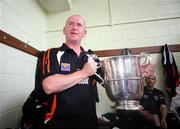 27 July 2008; Armagh manager Peter McDonnell celebrates with the cup in the dressing room. GAA Football Ulster Senior Championship Final replay, Armagh v Fermanagh, St Tighearnach's Park, Clones, Co. Monaghan. Picture credit: Oliver McVeigh / SPORTSFILE *** Local Caption *** S0807107 Armagh v Fermanagh OMcV