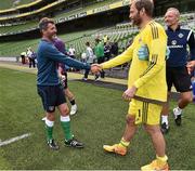 4 June 2015; Roy Keane, Republic of Ireland  assistant manager, shakes hands with Northern Ireland goalkeeper Roy Carroll at the end of the game. Training Match, Republic of Ireland v Northern Ireland. Aviva Stadium, Lansdowne Road, Dublin. Picture credit: David Maher / SPORTSFILE