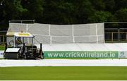 5 June 2015; Ground staff work hard to get the out field ready in time for play on the fourth day. ICC InterContinental Cup, Ireland v United Arab Emirates. Malahide Cricket Club, Malahide, Co. Dublin. Picture credit: Seb Daly / SPORTSFILE