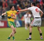 17 May 2015; David Walsh, Donegal, and Justin McMahon, Tyrone, tussle off the ball. Ulster GAA Football Senior Championship, Preliminary Round, Donegal v Tyrone. MacCumhaill Park, Ballybofey, Co. Donegal. Picture credit: Stephen McCarthy / SPORTSFILE