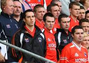 29 June 2008; Armagh players Aaron Kernan, Tony Kernan and Oisin McConville, stand, on the subs bench, for the National Anthem. GAA Football Ulster Senior Championship Semi-Final, Down v Armagh, St Tighearnach's Park, Clones, Co. Monaghan. Picture credit: Oliver McVeigh / SPORTSFILE