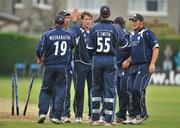 31 July 2008; John Blain, centre, Scotland, is congratulated by his team-mates after bowling out William Porterfield, Ireland. Ireland v Scotland, One Day International, Clontarf Cricket Club, Dublin. Picture credit: Matt Browne / SPORTSFILE