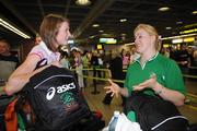 1 August 2008; Members of the Ireland Olympic Athletics team Joanne Cuddihy, 400m, left, and Eileen O'Keeffe, Hammer, prepare to depart for Beijing. Dublin Airport, Dublin. Picture credit: Brian Lawless / SPORTSFILE
