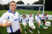 31 July 2008; The 9th annual MBNA Kick Fada competition was launched at Herbert Park, over 20 Inter-County Gaelic Football stars are set to compete for the prestigious All-Ireland title at the 2008 MBNA Kick Fada Final, which takes place on Saturday 13th at Bray Emmets GAA Club. Reigning champion John Brennan, from Carlow, will be back to defend his title after winning with a kick of 67 metres. At the launch is Dublin master free taker Tomas Quinn with Bray Emmets GAA club members, from left, Olivia Duffy, Meghan Donegan, Owen Duffy, and Aoife Connaughton. Herbert Park Hotel, Ballsbridge, Dublin. Picture credit: Brian Lawless / SPORTSFILE