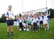 31 July 2008; The 9th annual MBNA Kick Fada competition was launched at Herbert Park, over 20 Inter-County Gaelic Football stars are set to compete for the prestigious All-Ireland title at the 2008 MBNA Kick Fada Final, which takes place on Saturday 13th at Bray Emmets GAA Club. Reigning champion John Brennan, from Carlow, will be back to defend his title after winning with a kick of 67 metres. At the launch is Dublin master free taker Tomas Quinn cheered on by children from Kilmacud Crokes GAA club, Raheny GAA club, Holy Trinity School, and Bray Emmets GAA. Herbert Park Hotel, Ballsbridge, Dublin Picture credit: Brian Lawless / SPORTSFILE