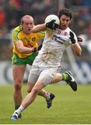 17 May 2015; Mattie Donnelly, Tyrone, is tackled by Neil Gallagher, Donegal. Ulster GAA Football Senior Championship, Preliminary Round, Donegal v Tyrone. MacCumhaill Park, Ballybofey, Co. Donegal. Picture credit: Stephen McCarthy / SPORTSFILE