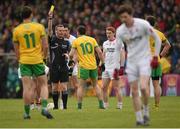 17 May 2015; Referee Joe McQuillan issues a yellow card to Martin O'Reilly, Donegal. Ulster GAA Football Senior Championship, Preliminary Round, Donegal v Tyrone. MacCumhaill Park, Ballybofey, Co. Donegal. Picture credit: Stephen McCarthy / SPORTSFILE