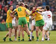 17 May 2015; Tyrone and Donegal players tussle during the game. Ulster GAA Football Senior Championship, Preliminary Round, Donegal v Tyrone. MacCumhaill Park, Ballybofey, Co. Donegal. Picture credit: Stephen McCarthy / SPORTSFILE