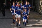 6 June 2015; Laois captain Ross Munnelly accompanied by mascot Callum McElroy, from the Arles Kilcruise GAA Club, lead the team out ahead of the game. Leinster GAA Football Senior Championship Quarter-Final, Kildare v Laois. O'Connor Park, Tullamore, Co. Offaly. Picture credit: Stephen McCarthy / SPORTSFILE