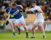 6 June 2015; Padraig Fogarty, Kildare, in action against Mark Timmons, Laois. Leinster GAA Football Senior Championship Quarter-Final, Kildare v Laois. O'Connor Park, Tullamore, Co. Offaly. Picture credit: Piaras Ó Mídheach / SPORTSFILE