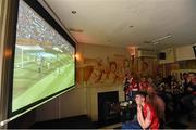 7 June 2015; Cork and Waterford supporters watch the Republic of Ireland v England game in Lar Corbett's Bar in Thurles. Munster GAA Hurling Senior Championship Semi-Final, Waterford v Cork. Thurles, Co. Tipperary. Picture credit: Stephen McCarthy / SPORTSFILE