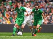 7 June 2015; Wayne Rooney, England is tackled by Glenn Whelan and Marc Wilson, Republic of Ireland. Three International Friendly, Republic of Ireland v England. Aviva Stadium, Lansdowne Road, Dublin. Picture credit: Seb Daly / SPORTSFILE