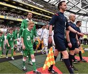 7 June 2015; The two captains of John O'Shea, Republic of Ireland, and Wayne Rooney, England lead out the teams. Three International Friendly, Republic of Ireland v England. Aviva Stadium, Lansdowne Road, Dublin. Picture credit: David Maher / SPORTSFILE