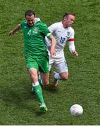 7 June 2015; John O'Shea, Republic of Ireland, in action against Wayne Rooney, England. Three International Friendly, Republic of Ireland v England. Aviva Stadium, Lansdowne Road, Dublin. Picture credit: Ramsey Cardy / SPORTSFILE