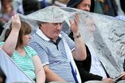 3 August 2008; Spectators take cover from the rain during the Kildare v Fermanagh game. All-Ireland Senior Football Championship Qualifier, Round 3, Fermanagh v Kildare, Croke Park, Dublin. Picture credit: David Maher / SPORTSFILE