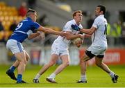 6 June 2015; Paul Cribbin, Kildare, supported by team-mate Padraig O'Neill, right, in action against John O'Loughlin, Laois. Leinster GAA Football Senior Championship Quarter-Final, Kildare v Laois. O'Connor Park, Tullamore, Co. Offaly. Picture credit: Piaras Ó Mídheach / SPORTSFILE
