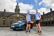 8 June 2015; Pictured is Dublin players, hurler Michael Carton, left, and footballer Denis Bastick celebrating the launch of Summer Showtime for Toyota, the official car partner to Dublin GAA, which begins on 10th June and runs until 13th June. The annual Showtime event will see Toyota showcase its full '152' commercial and passenger model line-up including the new Avensis, the new Auris and the RAV4, and providing entertainment and fun activities for all the family. During Showtime, Toyota dealers are also offering a trade up allowance offer of up to €3,000 on passenger cars registered by July 31st, or three years free servicing on passenger cars ordered before June 19th. For further information www.toyota.ie. Royal Hospital Kilmainham, Dublin. Picture credit: Ramsey Cardy / SPORTSFILE