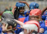 8 June 2015; Magdaline Agbonlahor, St Brigid's GNS Palmerstown, puts on her helmet before the start of the second half. Scoil Lorcán, Monkstown, v St Brigid's GNS Palmerstown. Sciath INTO. Allianz Cumann na mBunscol Finals, Croke Park, Dublin. Picture credit: Piaras Ó Mídheach / SPORTSFILE