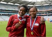 8 June 2015; Whitney Adamu, left, and Peace Faroye, St John the Evangelist NS, Adamstown, celebrate with their medals after beating Scoi Bhríde, Blanchardstown in the Sciath na Mumhan. Allianz Cumann na mBunscol Finals, Croke Park, Dublin. Picture credit: Piaras Ó Mídheach / SPORTSFILE